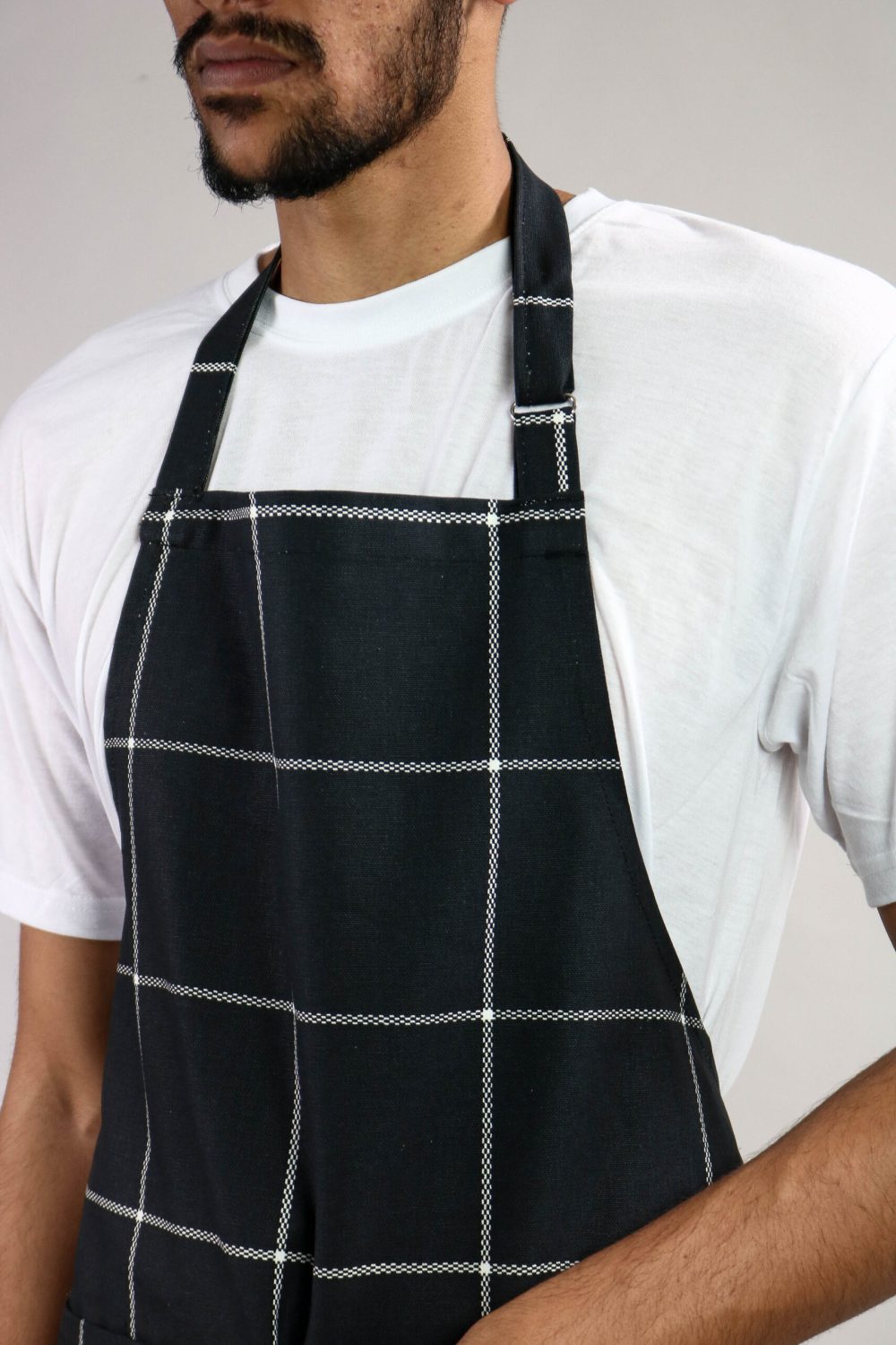 Man Wearing Navy Kitchen Aprons Side View